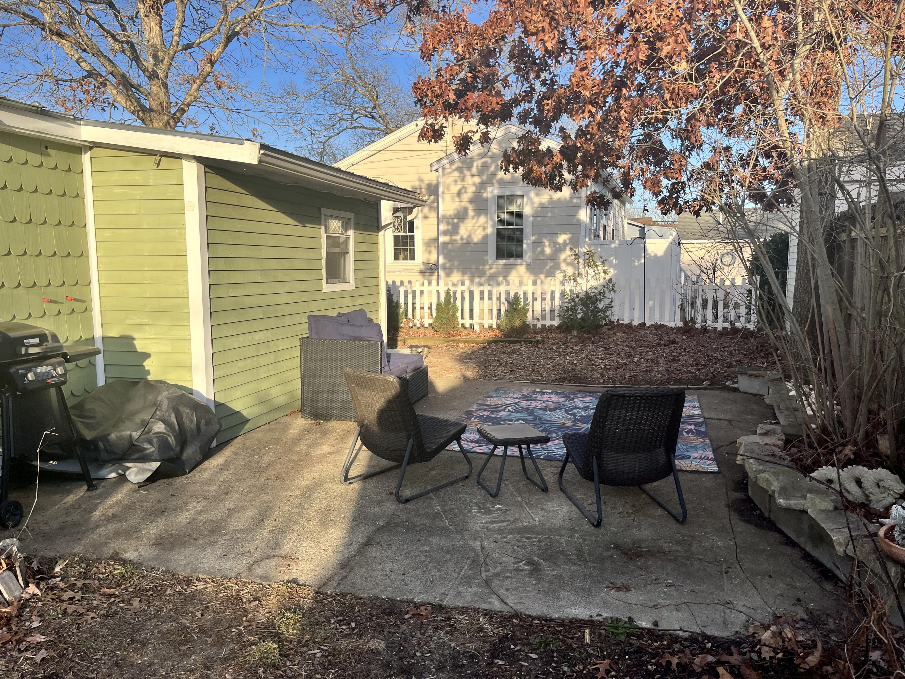 8 Trinity Lane Wareham, MA 02571 - Photo 34 of 49 a view of a patio with table and chairs and potted plants