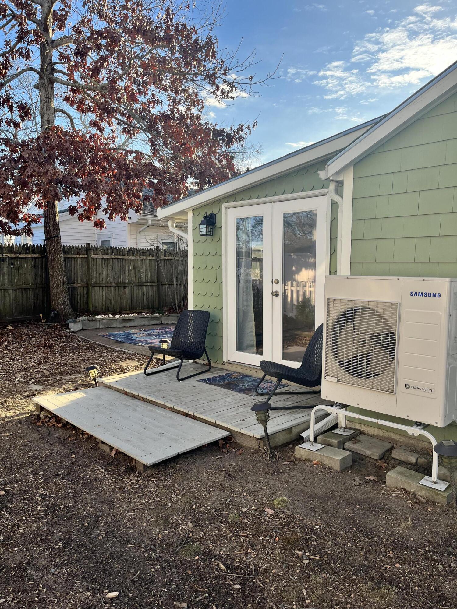 8 Trinity Lane Wareham, MA 02571 - Photo 38 of 49 a backyard of a house with barbeque oven table and chairs