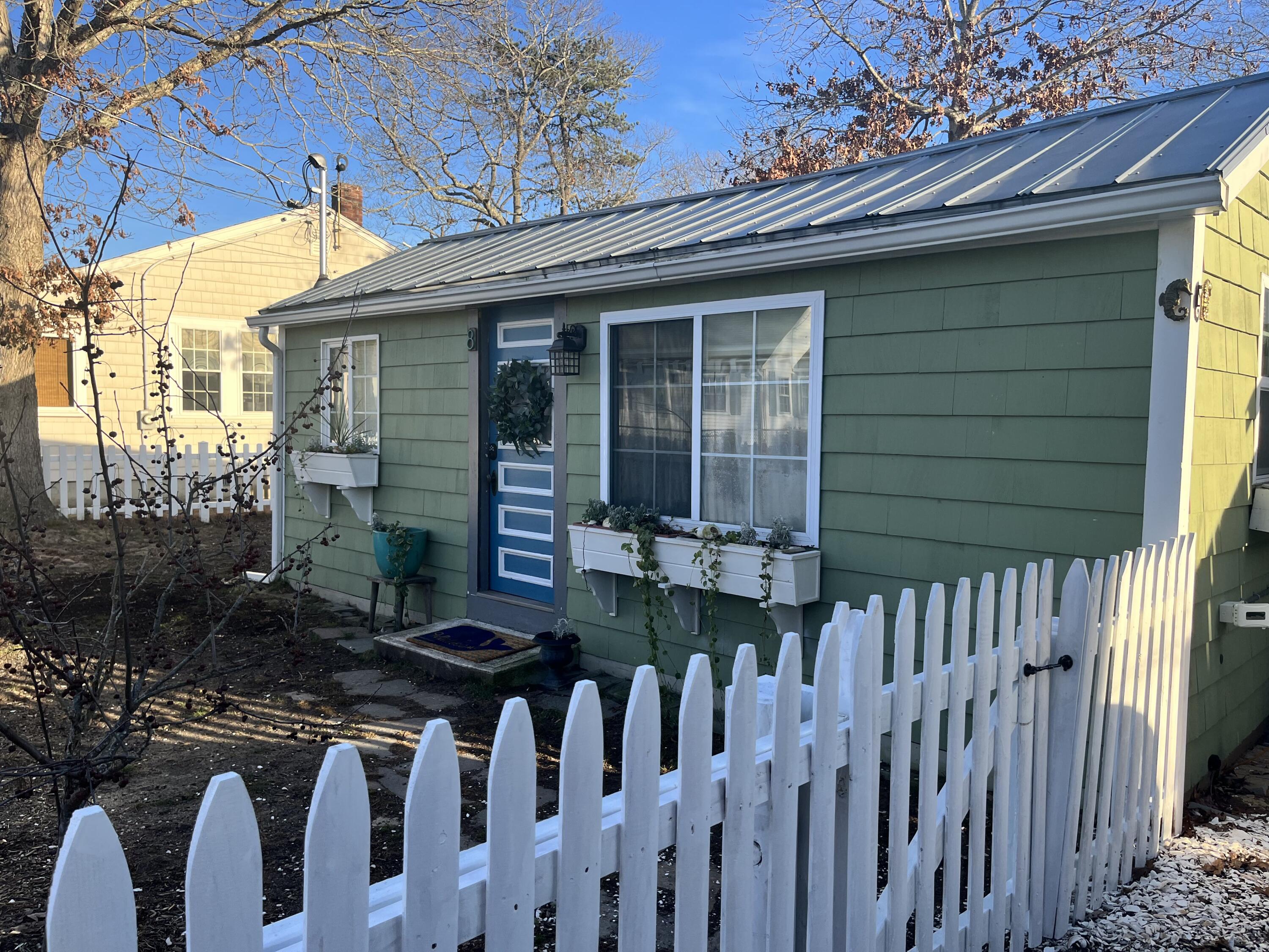 8 Trinity Lane Wareham, MA 02571 - Photo 40 of 49 a front view of a house with a porch