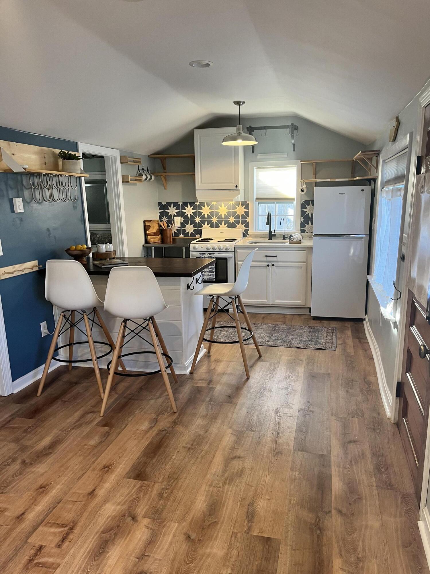 8 Trinity Lane Wareham, MA 02571 - Photo 5 of 49 a kitchen with a sink cabinets and wooden floor