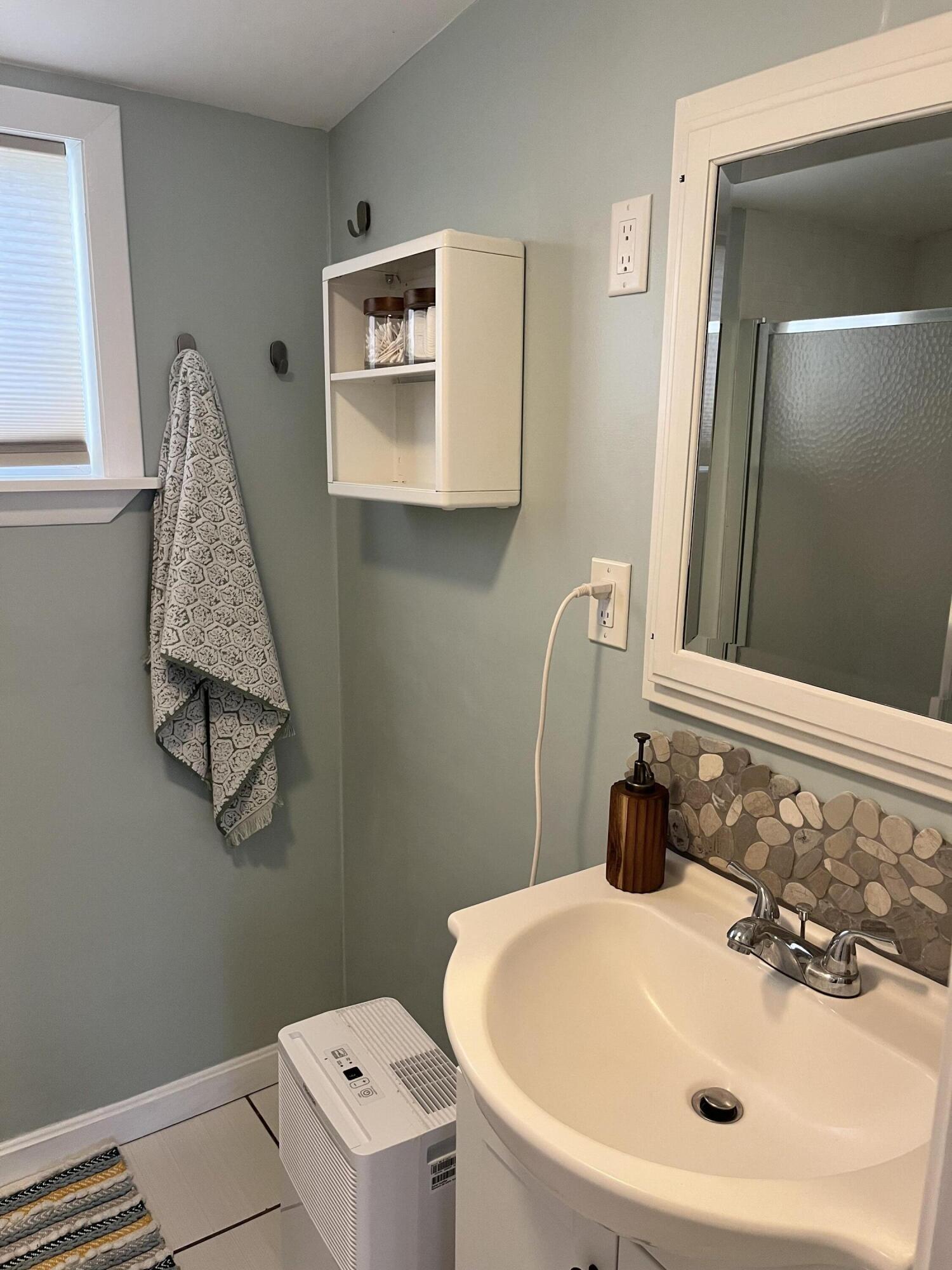 8 Trinity Lane Wareham, MA 02571 - Photo 7 of 49 a bathroom with a sink a toilet and mirror