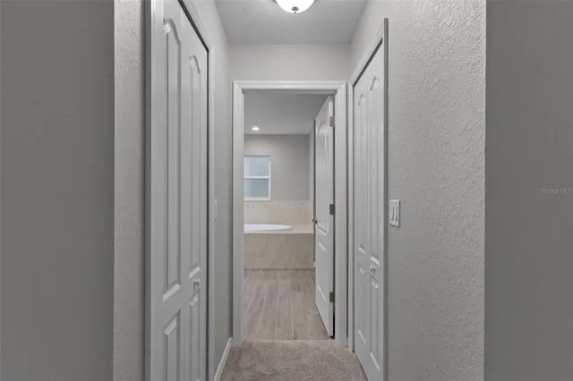 a view of a bathroom from a hallway