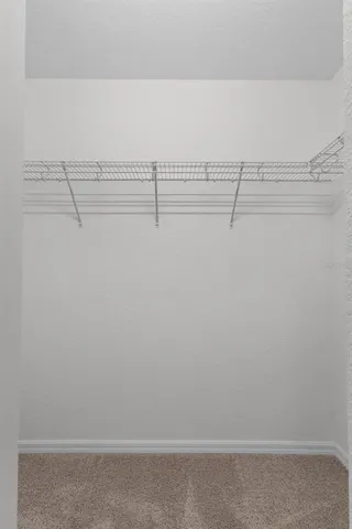 a view of a room with racks on the wall