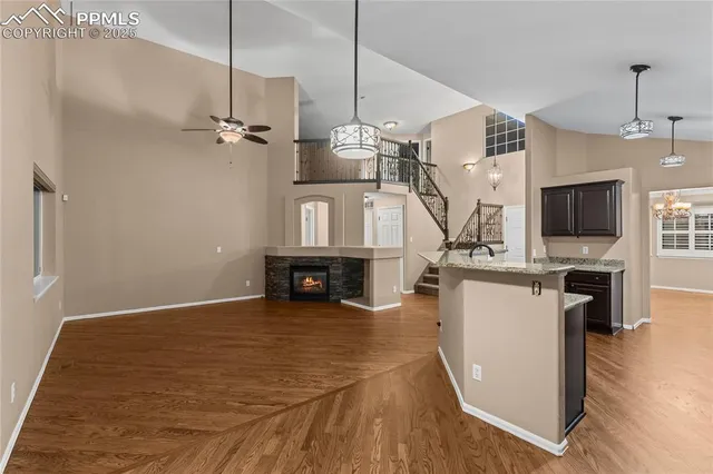 a view of kitchen and hall with wooden floor