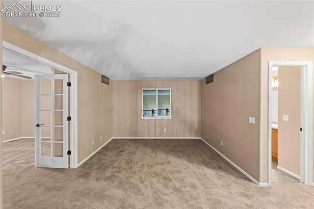 an empty room with windows