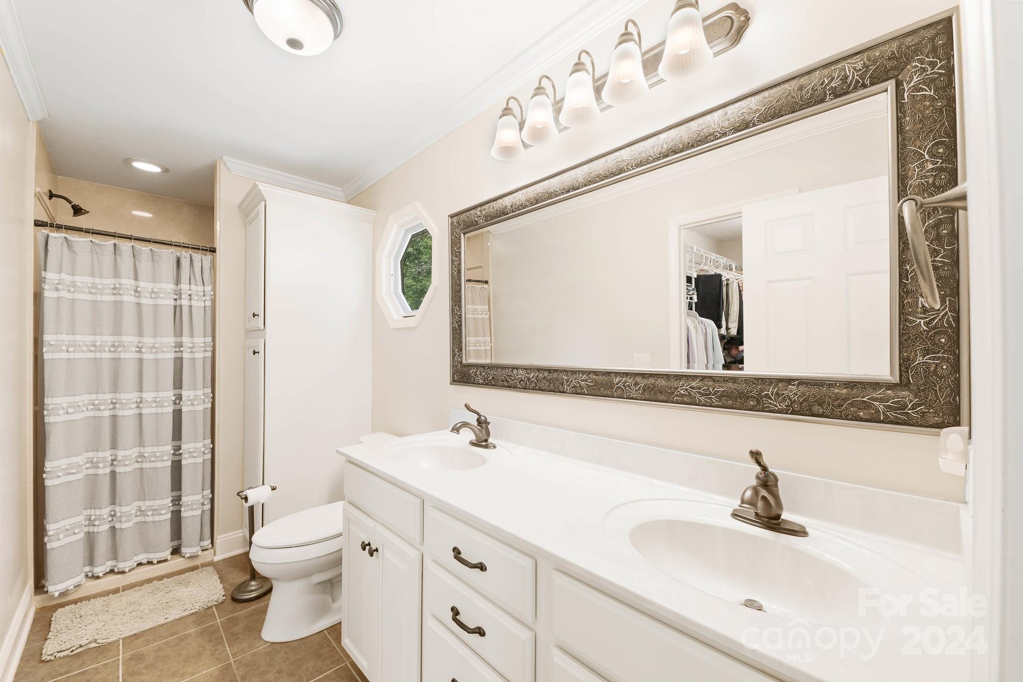 1135 Arabian Farm Road Clover, SC 29710 - Photo 14 of 48 a bathroom with a sink double vanity and a shower