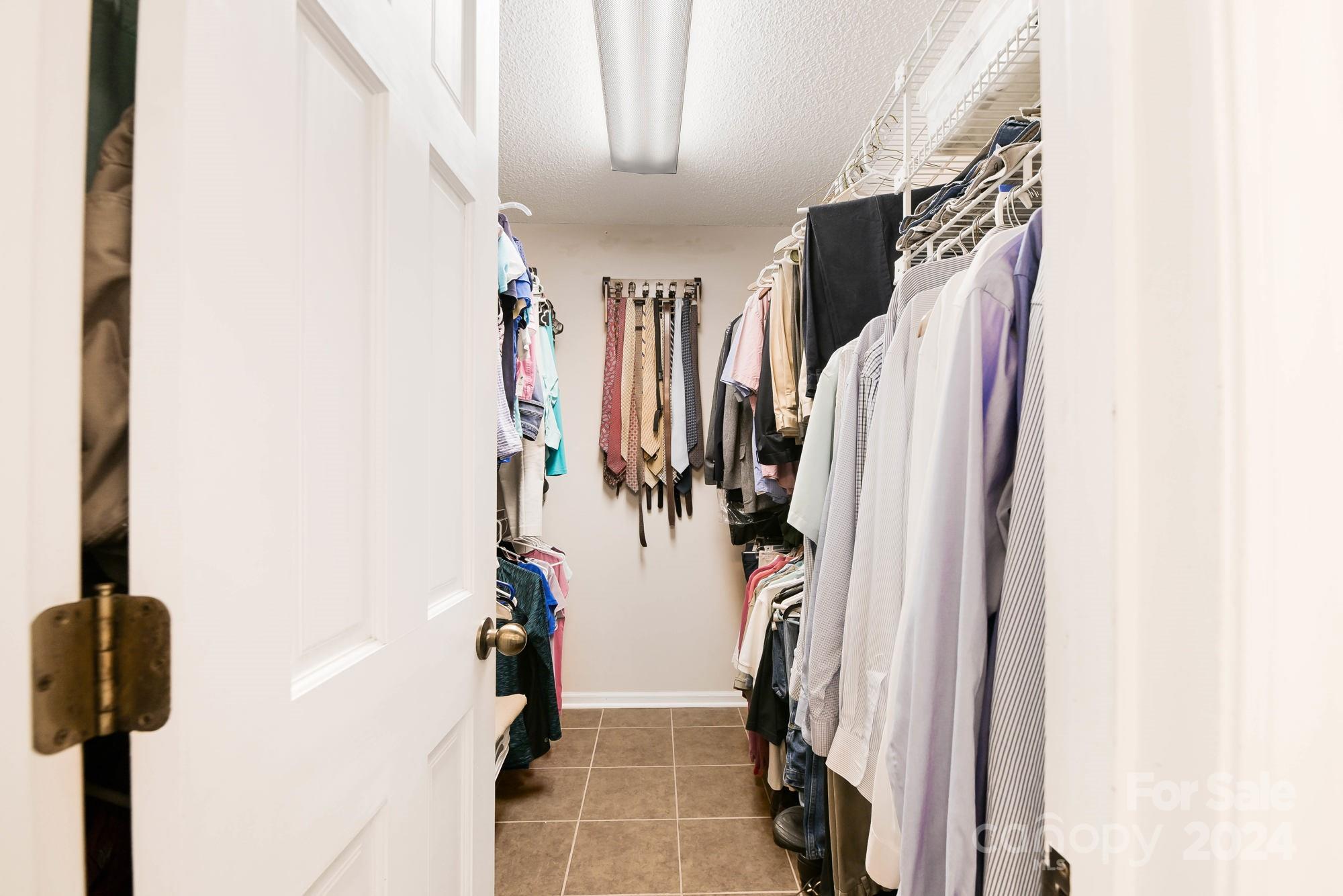 1135 Arabian Farm Road Clover, SC 29710 - Photo 15 of 48 a view of walk in closet with clothes and shoes