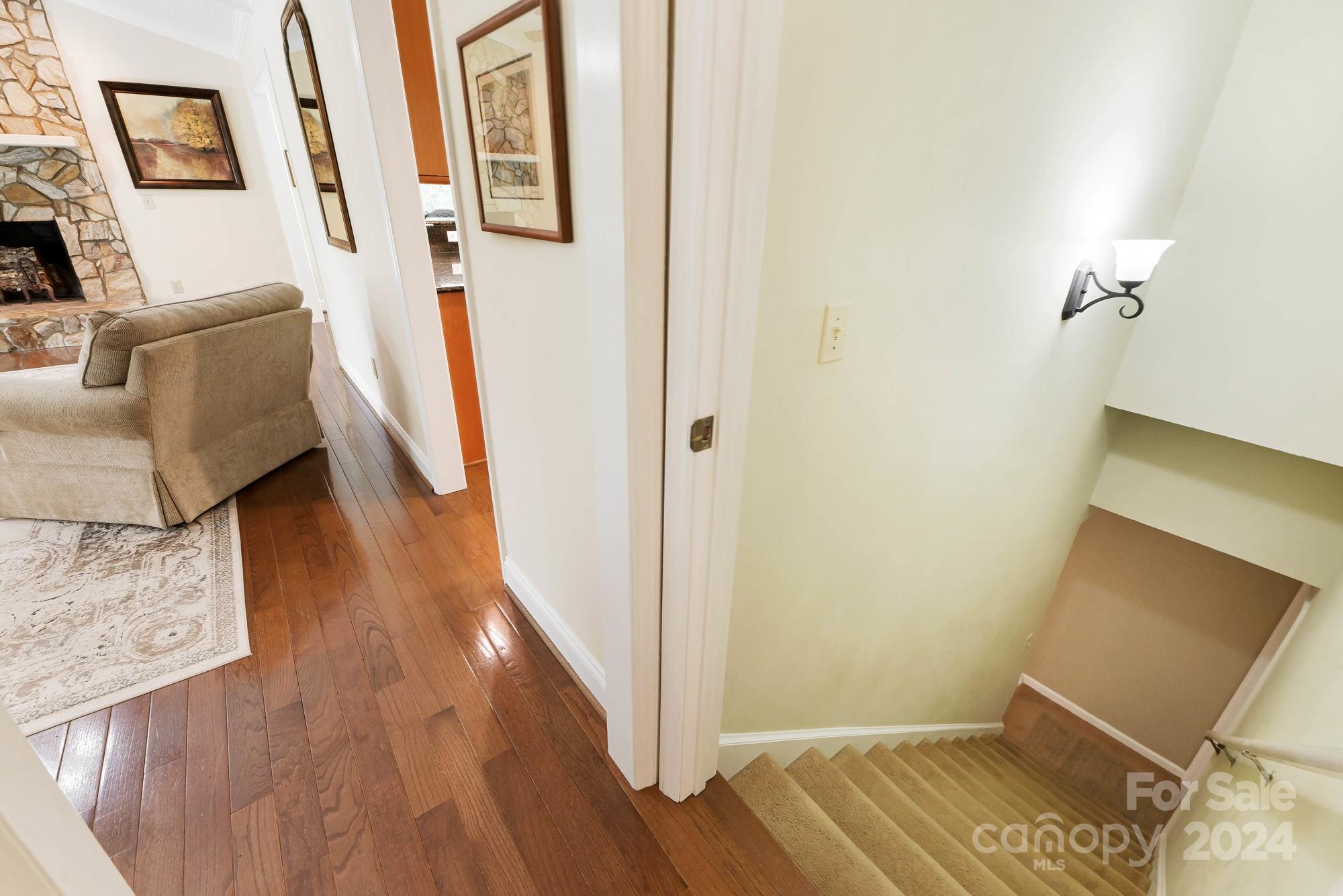 1135 Arabian Farm Road Clover, SC 29710 - Photo 18 of 48 a view of a hallway with furniture and wooden floor