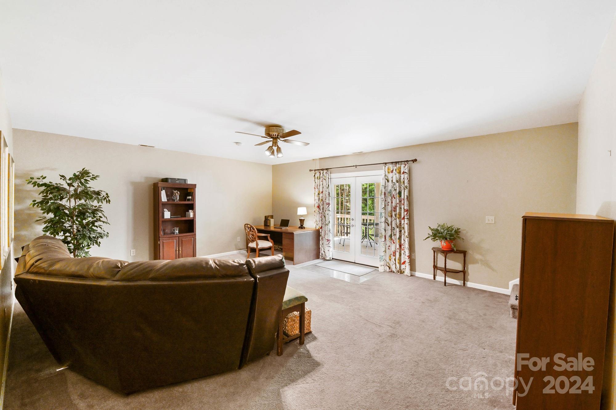 1135 Arabian Farm Road Clover, SC 29710 - Photo 19 of 48 a living room with furniture and a flat screen tv