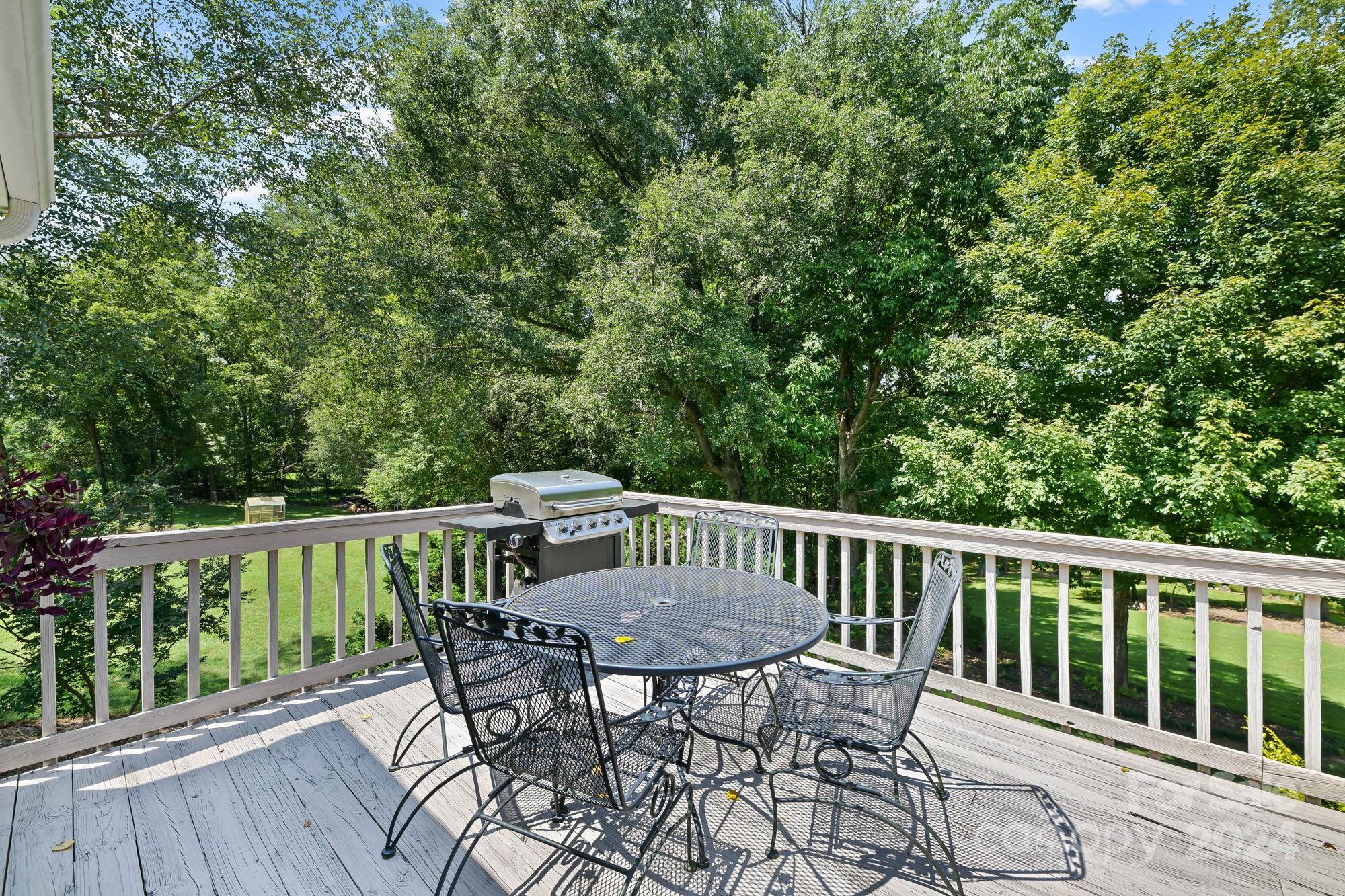 1135 Arabian Farm Road Clover, SC 29710 - Photo 26 of 48 a view of a table and chairs on the roof deck