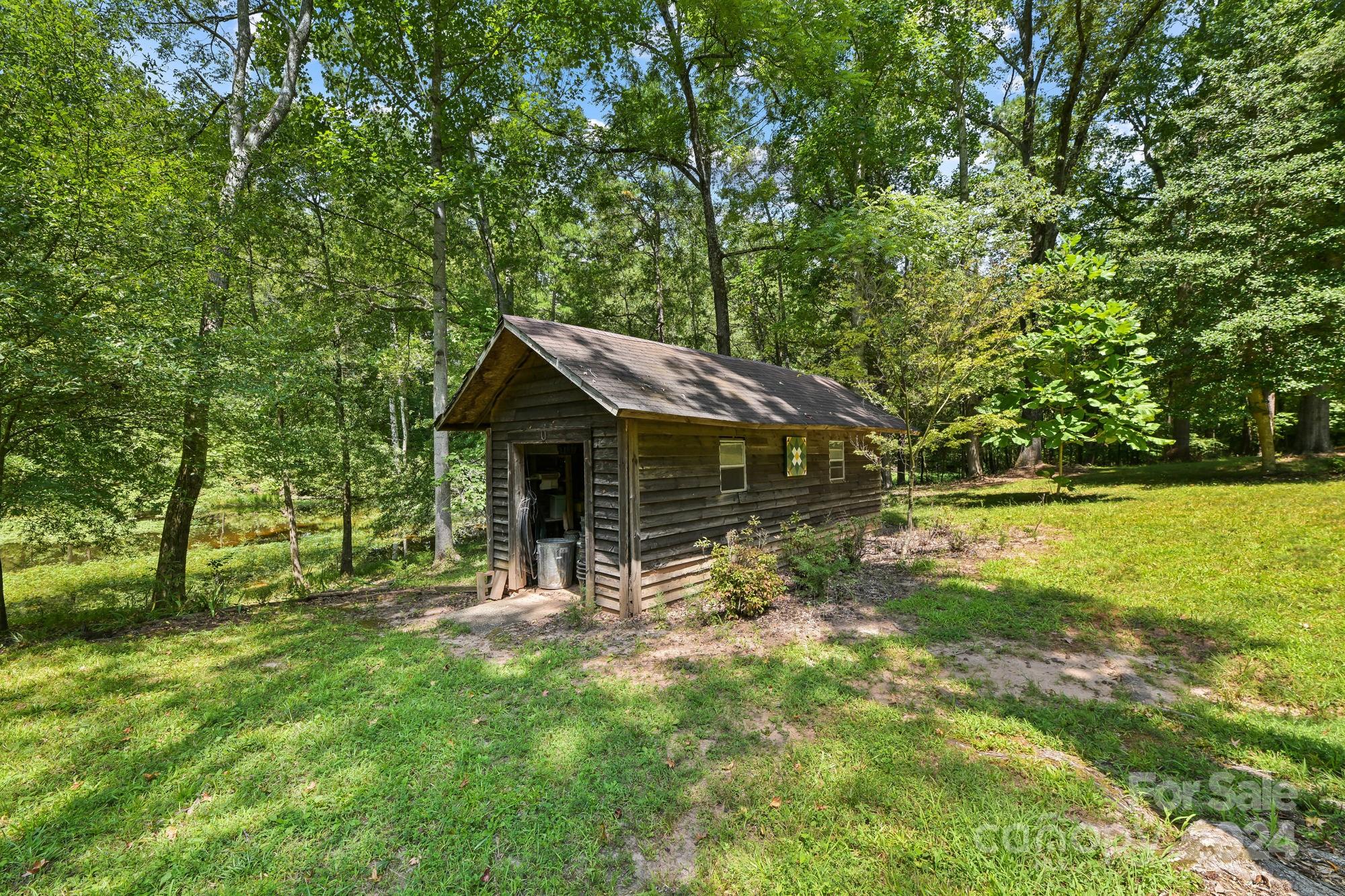 1135 Arabian Farm Road Clover, SC 29710 - Photo 32 of 48 a backyard of a house with table and chairs