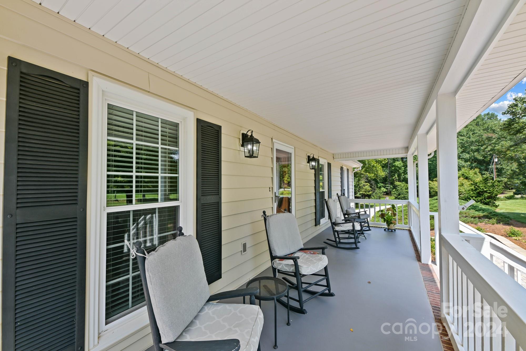 1135 Arabian Farm Road Clover, SC 29710 - Photo 4 of 48 a view of balcony with a couple of chairs and a large window