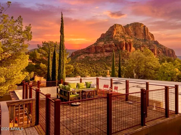 a view of a terrace with couches and wooden floor