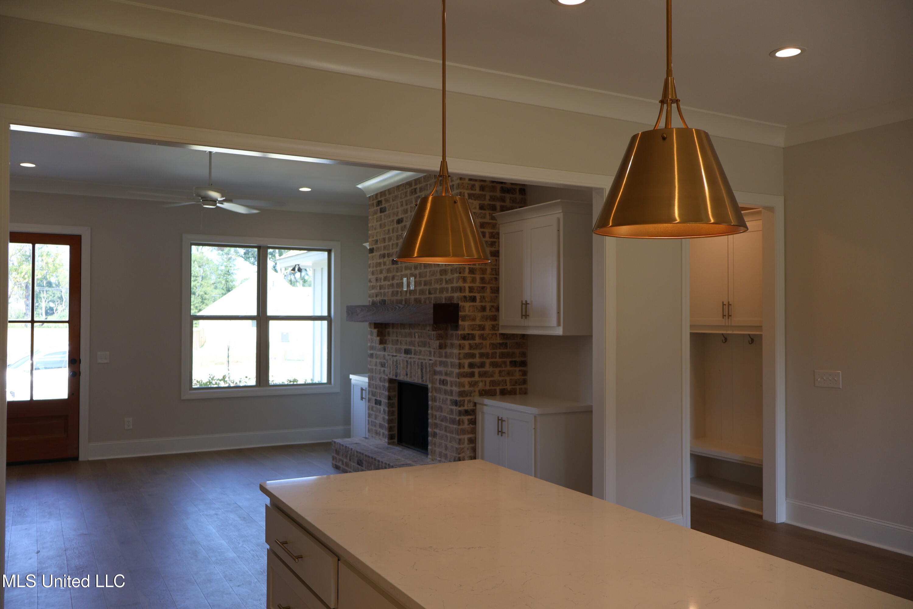 113 Southern Oak Way Canton, MS 39046 - Photo 3 of 12 113 living:fireplace:kitchen island and