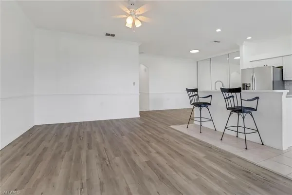 a view of work space with furniture and wooden floor