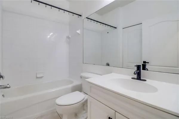 a bathroom with a sink a toilet and a bathtub