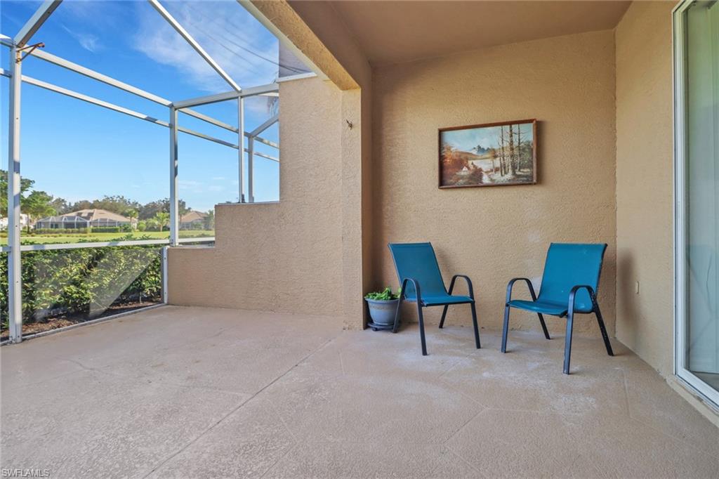 1677 Morning Sun Lane Naples, FL 34119 - Photo 24 of 41 a view of an chairs and table in the room