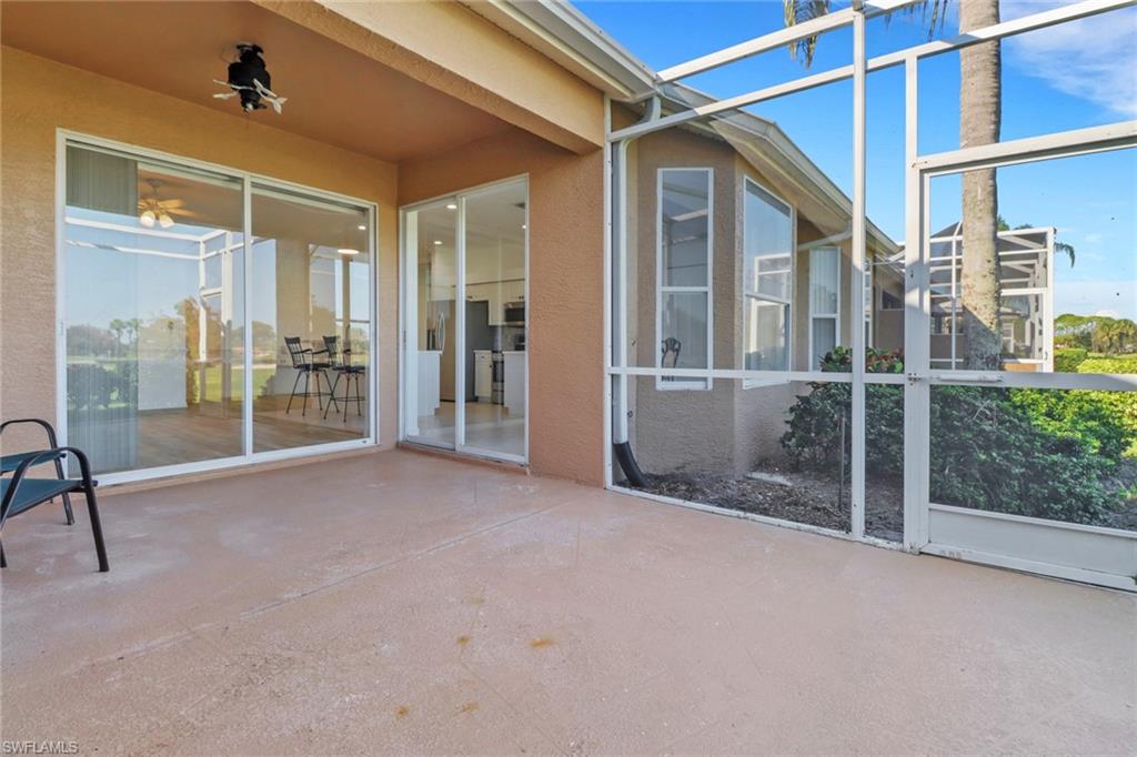 1677 Morning Sun Lane Naples, FL 34119 - Photo 26 of 41 a view of an empty room with glass door