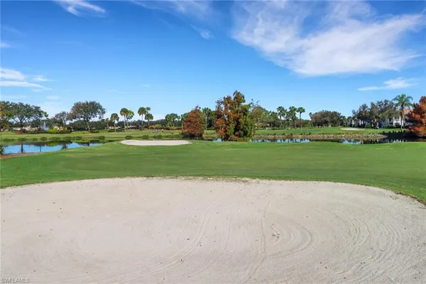 a view of a golf course with a lake