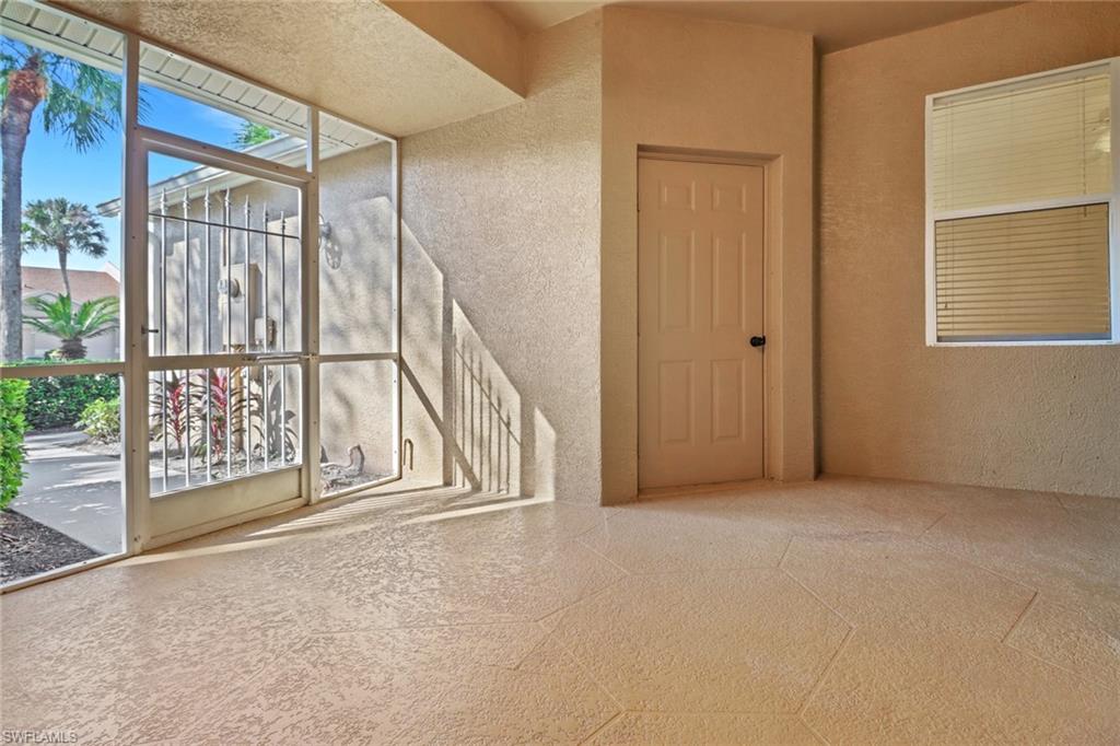 1677 Morning Sun Lane Naples, FL 34119 - Photo 3 of 41 an empty room with windows