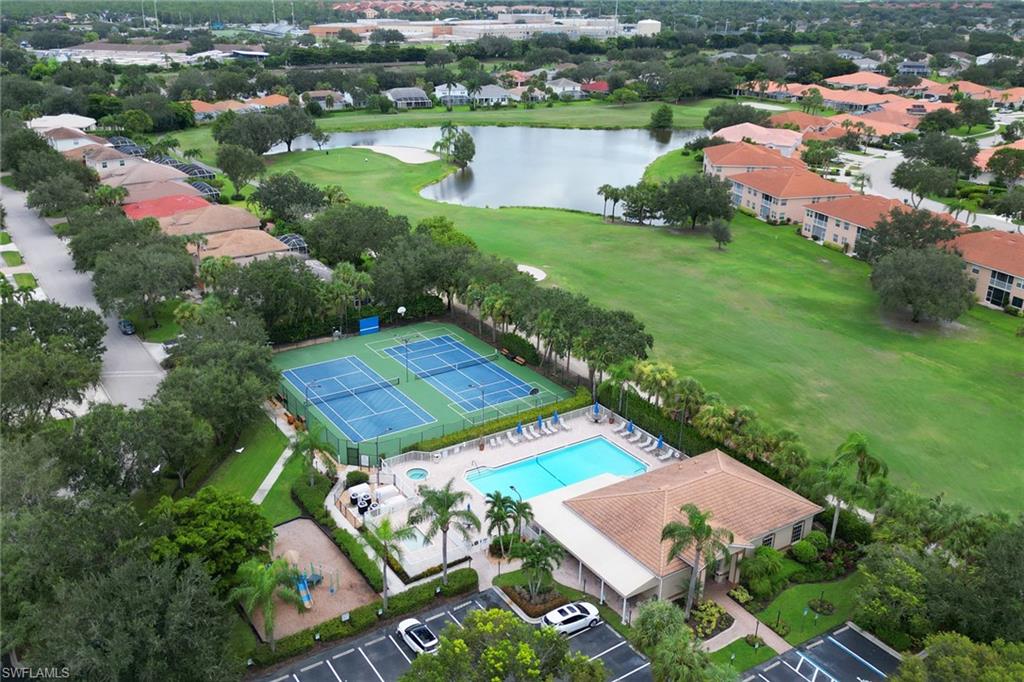 1677 Morning Sun Lane Naples, FL 34119 - Photo 32 of 41 an aerial view of a house with garden space and lake view