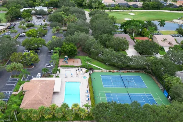 an aerial view of a house with pool outdoor seating and yard