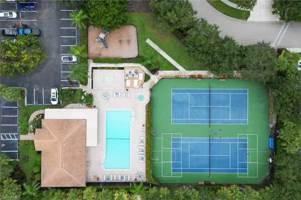 an aerial view of a house with a garden and a yard