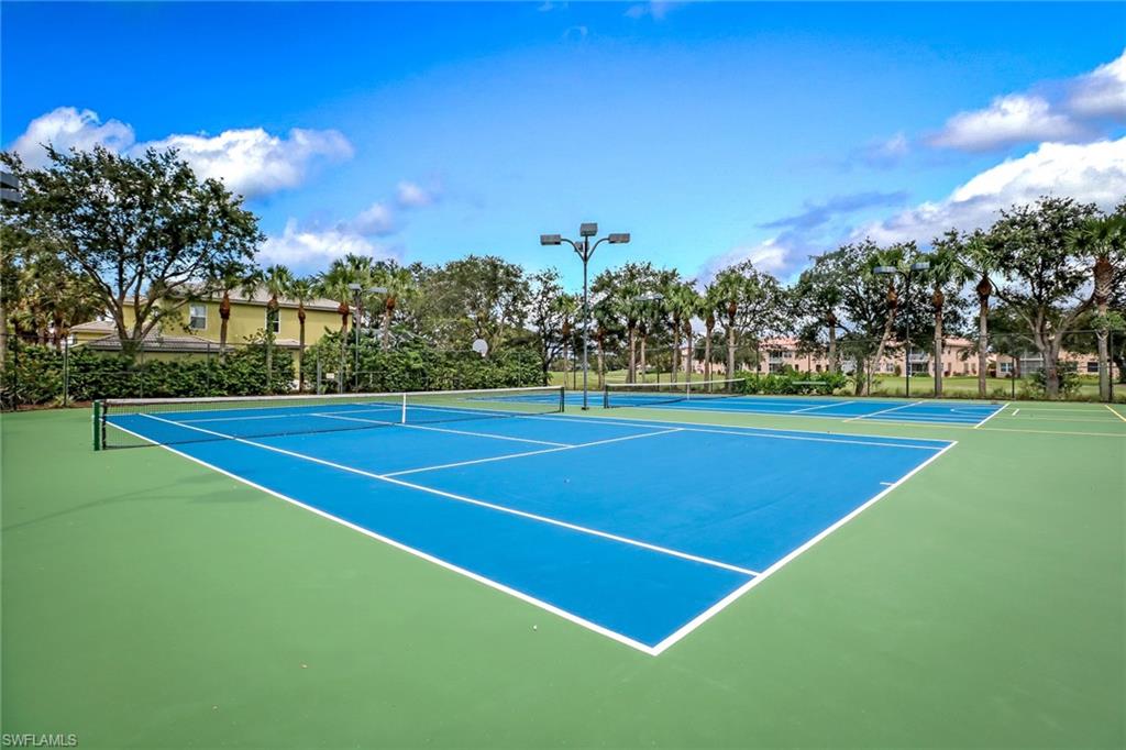 1677 Morning Sun Lane Naples, FL 34119 - Photo 35 of 41 a view of a tennis court