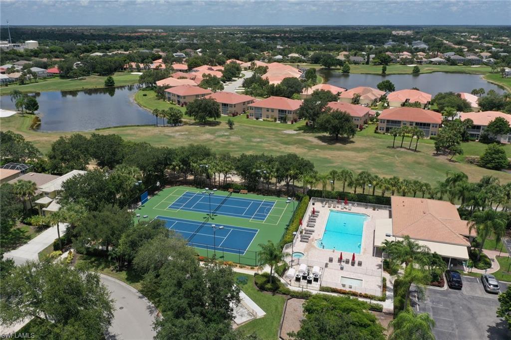 1677 Morning Sun Lane Naples, FL 34119 - Photo 37 of 41 an aerial view of residential houses with outdoor space and river
