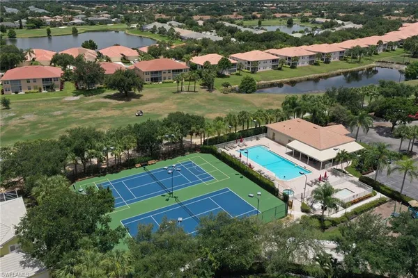 an aerial view of residential houses with outdoor space and street view