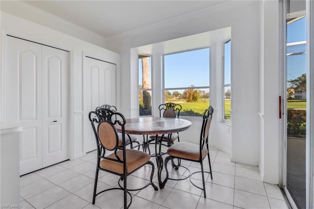 1677 Morning Sun Lane Naples, FL 34119 - Photo 10 of 41 a dining room with furniture and window