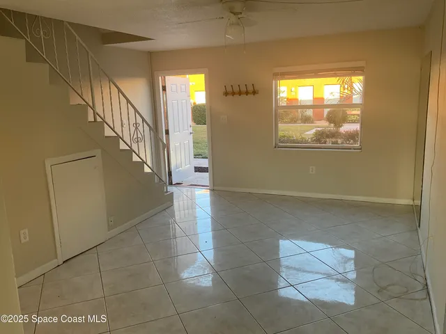 a view of entryway and hall with a window