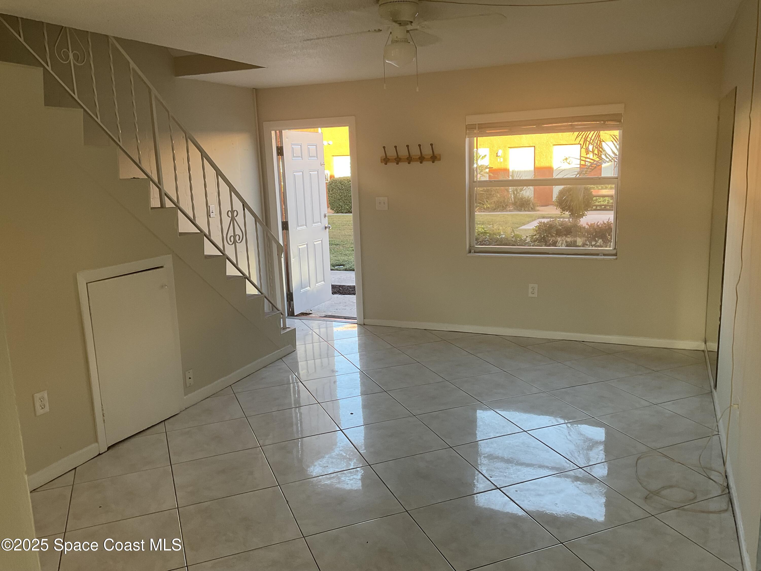 50 Needle Boulevard, Unit 29 Merritt Island, FL 32953 - Photo 4 of 11 a view of entryway and hall with a window