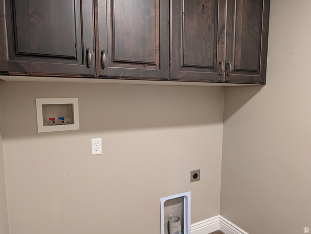 171 South Mustang Road East Grantsville, UT 84029 - Photo 9 of 41 Dark wood-finish cabinetry with silver-tone hardware, providing overhead storage