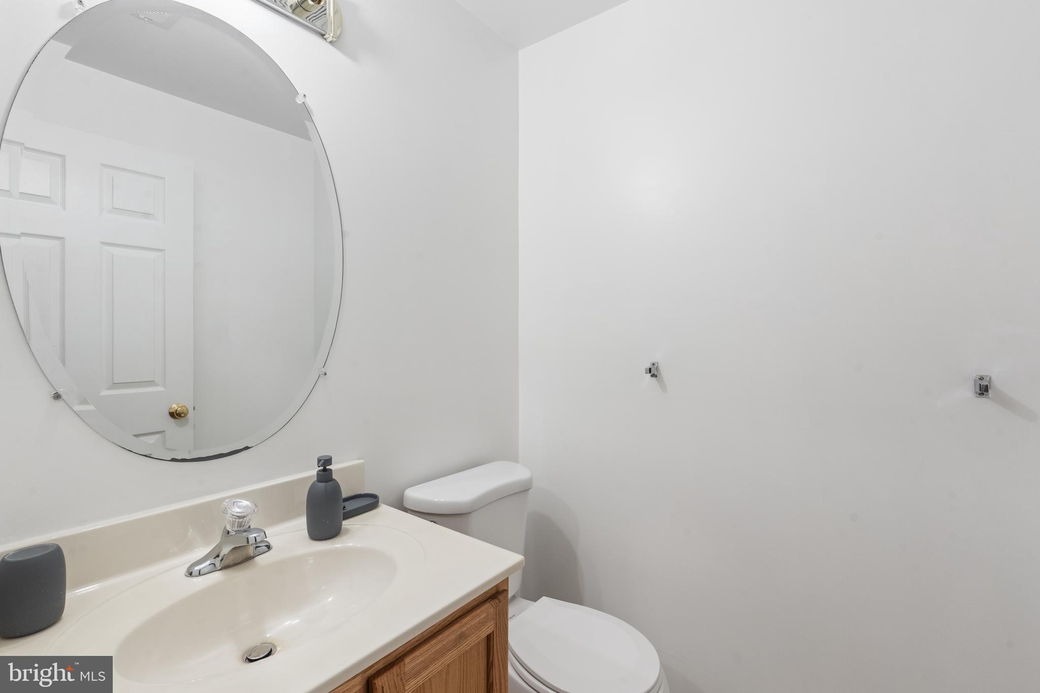 3132 Raking Leaf Drive Abingdon, MD 21009 - Photo 23 of 31 a bathroom with a sink and a mirror