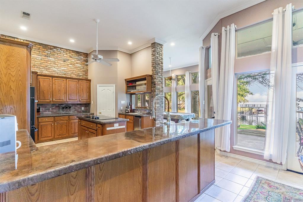 355 Beachside Drive Trinidad, TX 75163 - Photo 13 of 39 a kitchen with large windows and refrigerator