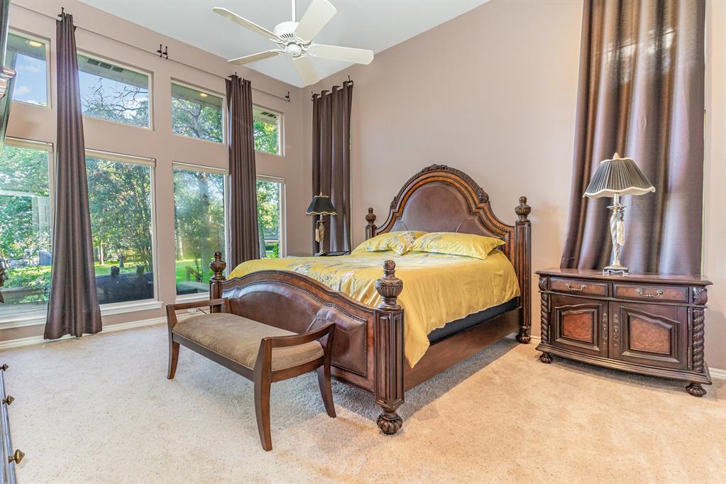 355 Beachside Drive Trinidad, TX 75163 - Photo 17 of 39 a bedroom with a bed and a dresser next to a window