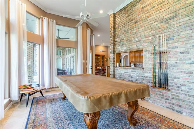 a dining room with a rug table and chairs
