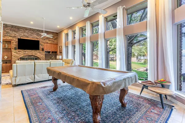 a living room with furniture a rug and a flat screen tv