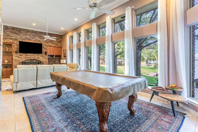a living room with furniture a rug and a flat screen tv