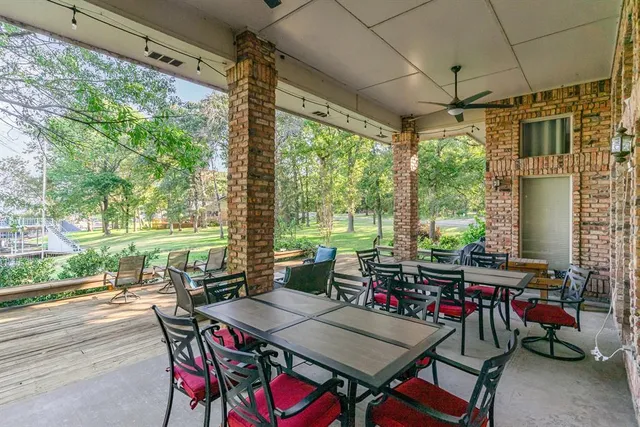 a view of a dining room with furniture window and outside view