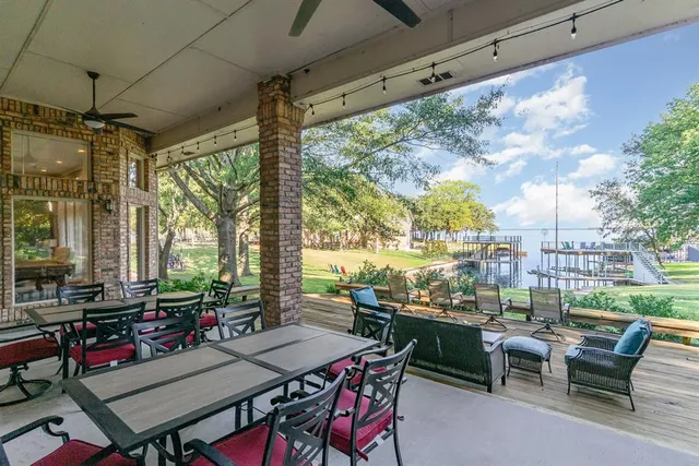 a view of a patio with a dining table and chairs