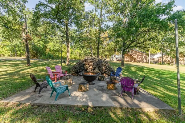 a view of a backyard with sitting area