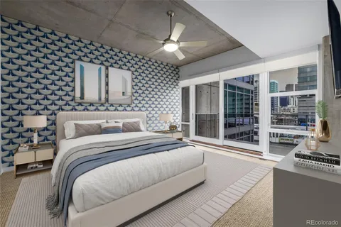 a spacious bedroom with a large bed and a large window