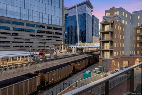 a kitchen with counter top space and wooden floor
