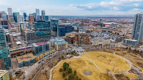 an aerial view of a residential building with an ocean view