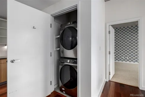 a view of a storage and utility room with washer and dryer