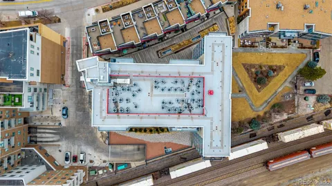 an aerial view of a residential apartment building with a swimming pool