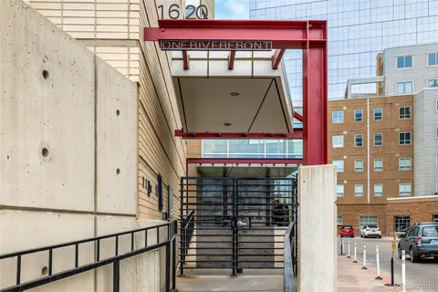 a view of a balcony with a red door