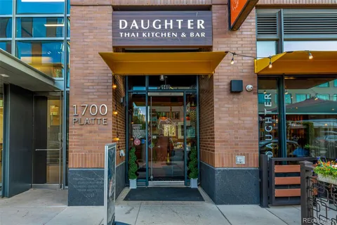 a view of a living room with furniture and a window